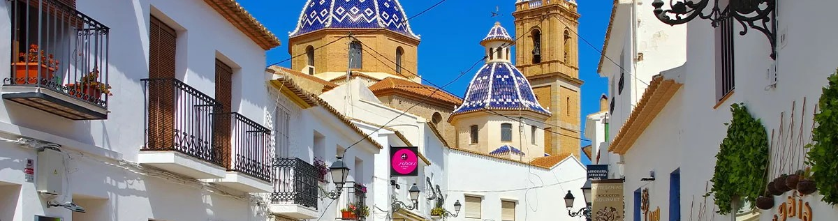 Street-scene-with-blue-roofs-and-bell-tower